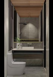 a bathroom with a sink and a toilet at Seis E Villa 4 Bedroom In Canggu in Badung +13 photos