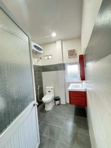 a small bathroom with a toilet and a sink at CaBu House Homestay Long Hải in Long Hai +13 photos