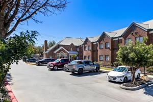 a row of cars parked in a parking lot at Park Inn by Radisson in San Antonio