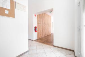 a hallway with a door with a fire hydrant in it at Villa Otto in Dunajská Streda
