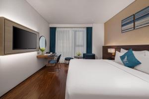 Canvas Danang Beach Hotel客房内的一张或多张床位