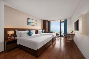 Canvas Danang Beach Hotel客房内的一张或多张床位