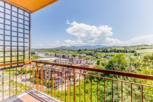 a balcony with a view of a city at Relax House Fonte Nuova - Relax a pochi minuti da Roma in Fonte Nuova