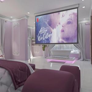 a room with a large screen with a woman on it at Đào Hoa Luxury in Quy Nhon