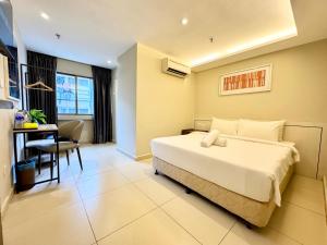 Postel nebo postele na pokoji v ubytování Kingston Hotel 1 - Bukit Bintang