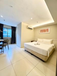 Postel nebo postele na pokoji v ubytování Kingston Hotel 1 - Bukit Bintang