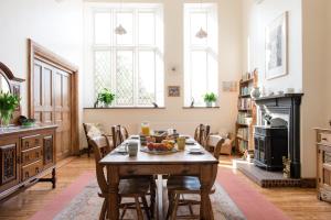 a dining room with a table with fruit on it at The School House in Bridgwater