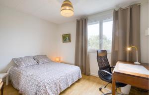 a bedroom with a bed and a desk and a chair at 3 Bedroom Awesome Home In Lagord in Lagord +22 photos