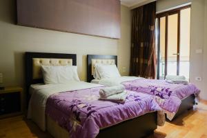 Postel nebo postele na pokoji v ubytování Hotel Shehu