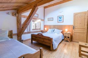 Ένα ή περισσότερα κρεβάτια σε δωμάτιο στο Chalet des Cimes