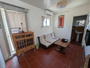 a living room with a couch and a table at Lanshe Gate in Chung-lan