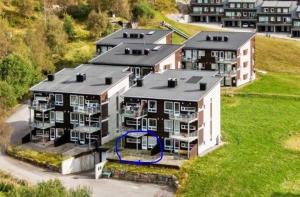 an aerial view of a large apartment building at Leisure apartment at Sinnes in Haugen +1 photo