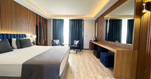 a hotel room with a bed and a desk at Elite World Resort Mersin Silifke in Silifke +57 photos