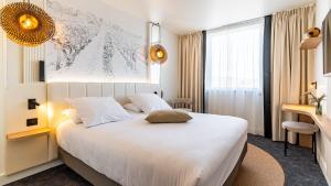 Postel nebo postele na pokoji v ubytování Mercure Beaune Centre