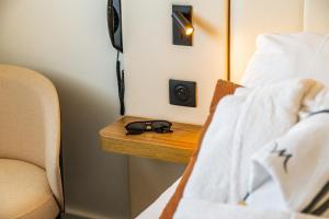 Postel nebo postele na pokoji v ubytování Mercure Beaune Centre