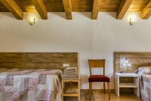 Postel nebo postele na pokoji v ubytování Casa rural Mas Plantalech
