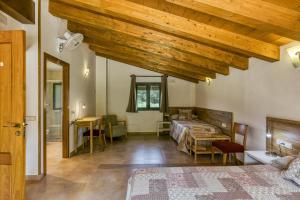 Postel nebo postele na pokoji v ubytování Casa rural Mas Plantalech