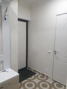 a bathroom with a toilet and a sink at Botanica, Shoping Molldova Testimiţianu in Chişinău +1 photo