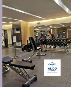 a group of people in a gym with machines at Mall of Asia condotel shore 3 residence in Manila