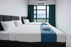 Postel nebo postele na pokoji v ubytování ENDLESS SUMMER Jesselton Quay Kota Kinabalu 來繕旅遊
