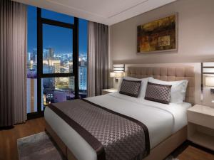 Postel nebo postele na pokoji v ubytování Movenpick Living Istanbul West