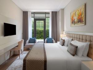 Postel nebo postele na pokoji v ubytování Movenpick Living Istanbul West