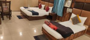 Postel nebo postele na pokoji v ubytování Hotel City Lite Delhi Airport