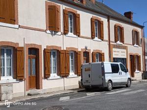 a white van parked in front of a building at 10 Boules B&B in Presly