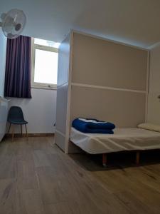 a bedroom with a bunk bed and a window at Albergue SP 55 by Bossh! Hotels in Santiago de Compostela +69 photos