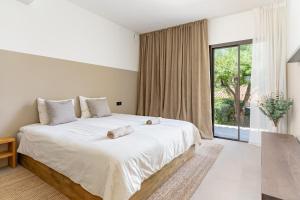 Postel nebo postele na pokoji v ubytování Casa Isola + 14 fotografií
