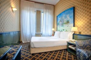 Postel nebo postele na pokoji v ubytování iH Hotels Milano Ambasciatori