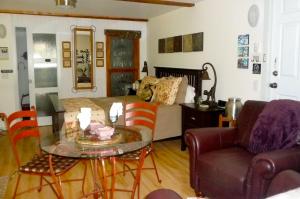 a living room with a glass table and a couch at Magnolia Petal in Ganges +37 photos
