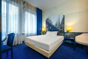 Postel nebo postele na pokoji v ubytování iH Hotels Milano Ambasciatori