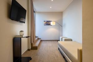 TV a/nebo společenská místnost v ubytování iH Hotels Milano Ambasciatori