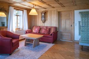 a living room with a couch and a table at Ferienwohnung Ritter in Schwarzenberg