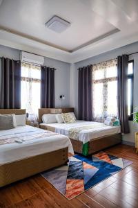 Postel nebo postele na pokoji v ubytování THE OASIS RESORT & VENUE CasaBien 4BR, 2TB, Pool,Wifi, Videoke, BBQ, Balcony, Guest , Near Naga City