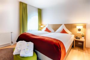 Postel nebo postele na pokoji v ubytování Welcome Hotel Marburg