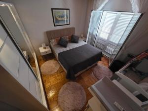 an overhead view of a bedroom with a bed and a window at Holiday Home Marković in Bibinje