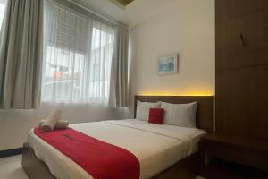 Letto o letti in una camera di RedDoorz Plus near Parahyangan University