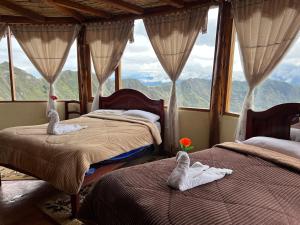 Postel nebo postele na pokoji v ubytování Quilotoa Lodge