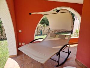 a chair in a room with a mirror at Villa Rosanna Bestvacationever in Torre delle Stelle