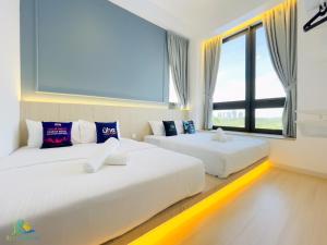 Letto o letti in una camera di Sunway Grid by RR JBcity