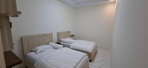 Postel nebo postele na pokoji v ubytování Homestay Sa'adah