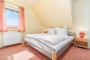 Postel nebo postele na pokoji v ubytování Ferienwohnung Atlantic