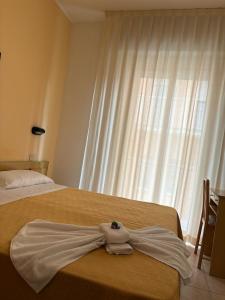 Postel nebo postele na pokoji v ubytování Hotel Sport