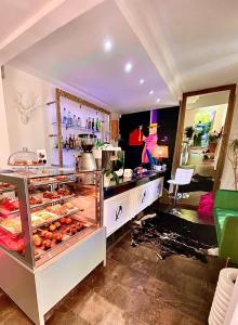 a room with a counter with some food on display at Maison Del Magra in Ameglia