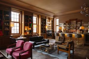 a living room filled with furniture and a bar at Landgoed Altenbroek in Voeren +72 photos