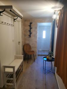 a living room with a couch and a table at Room No stress on Cres in Cres +10 photos