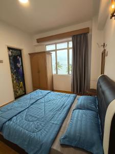 Postel nebo postele na pokoji v ubytování Glory Beach SeaView 3BR RamsHomestay + 22 fotografií