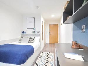 a bedroom with a large bed and a table at Market House in Newcastle in Newcastle upon Tyne +47 photos
